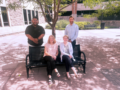 The Hokie Wellness team includes (from left) Hans Carlo Rivera, mental health specialist; Ana Agud, program manager for work/life balance; Julie Carlson, employee health educator; and Dave Andrews, associate director of employee wellness. 